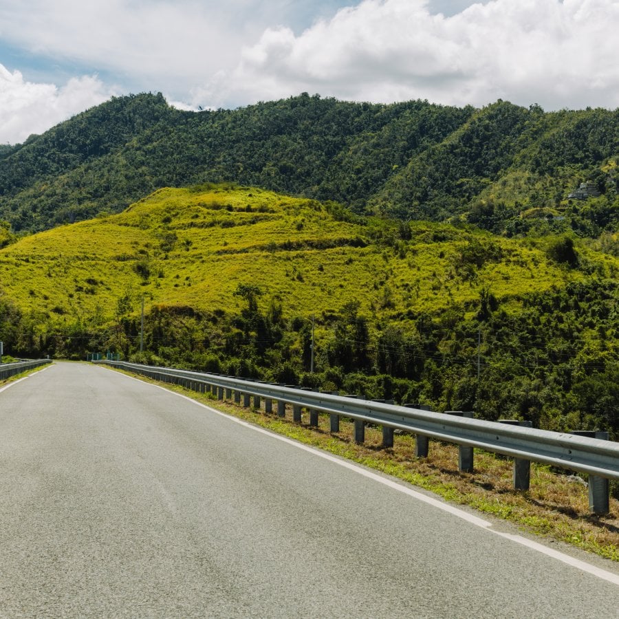 A wide view of a road through Puerto Rico's Mountains. 