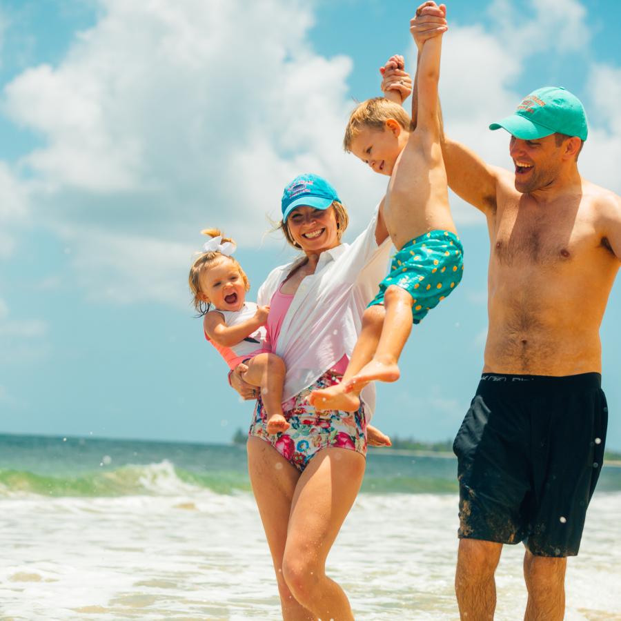 Family with toddlers at the beach