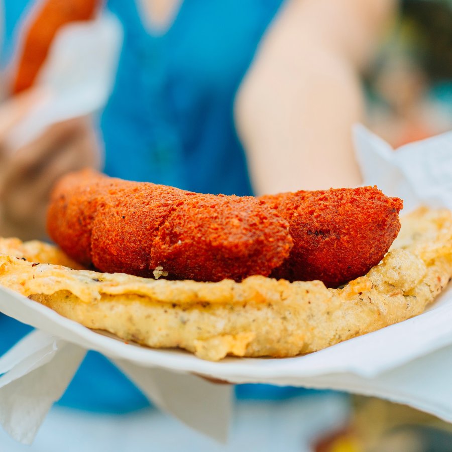 A plate full of Puerto Rican fritters.