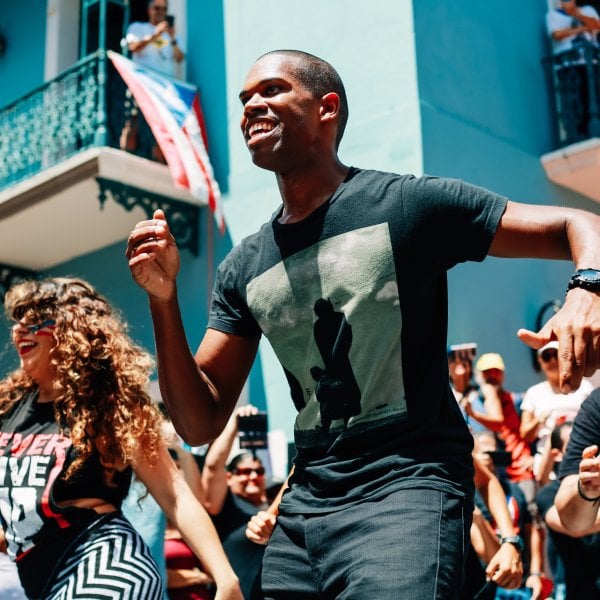 People dance in the streets of San Juan