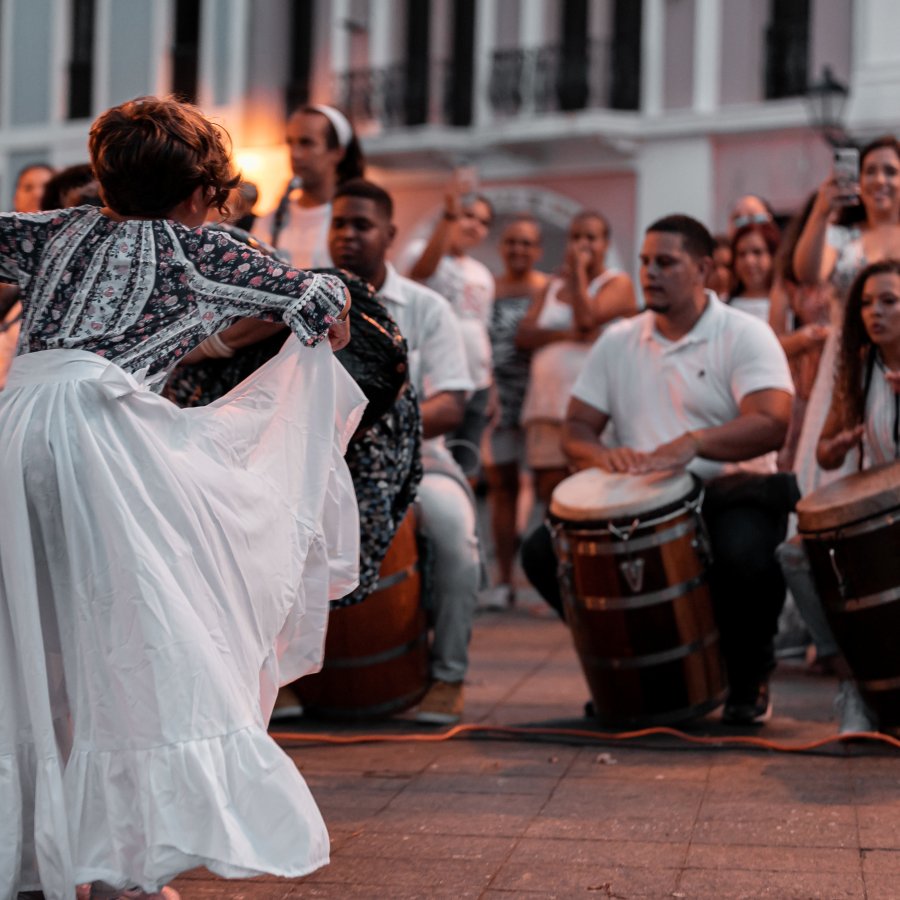 Musicians playing bomba and dancing.