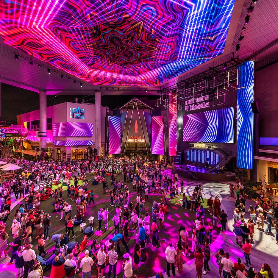 A crowd gathers outside Coca-Cola Music Hall at Distrito T-Mobile