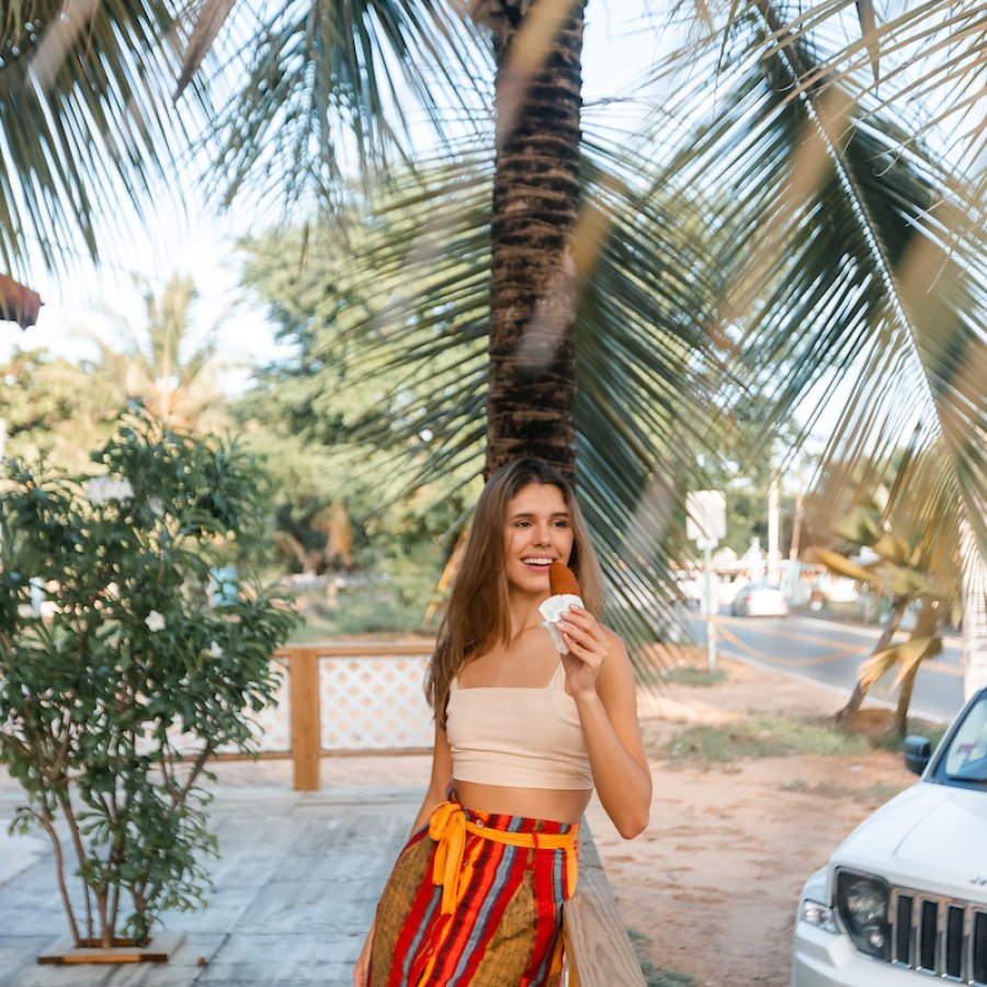 Woman eating alcapurrias