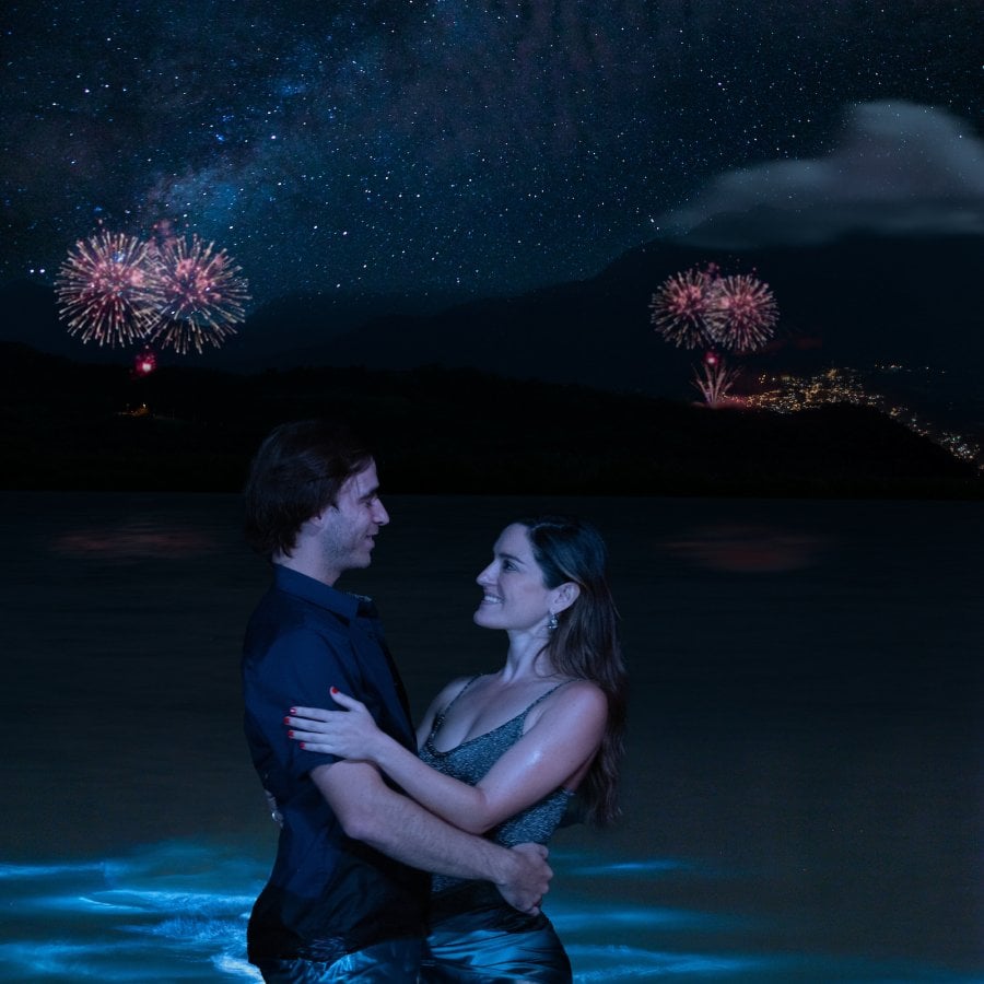 Couple celebrating New Year's Eve at the beach.