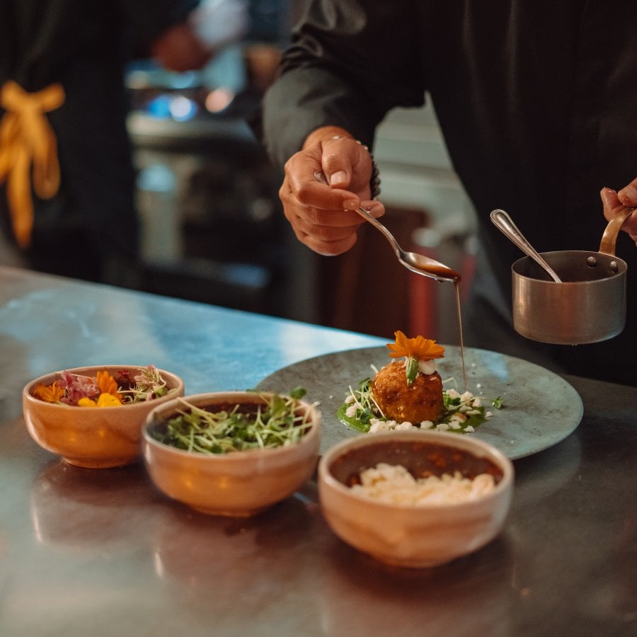 Chef plating dishes.