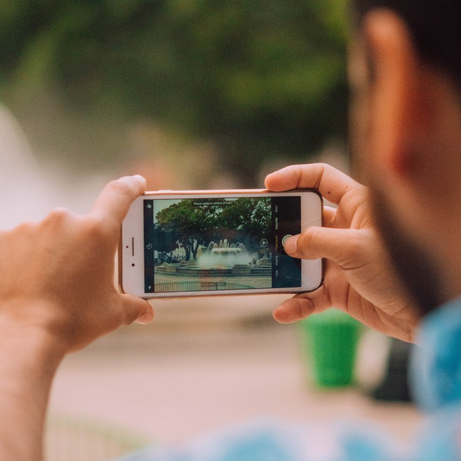 Person taking a picture on their phone.