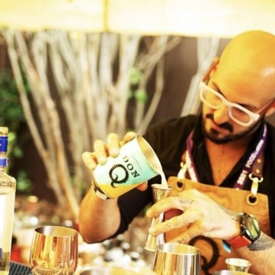 Bartender Israel Bravo mixing drinks.