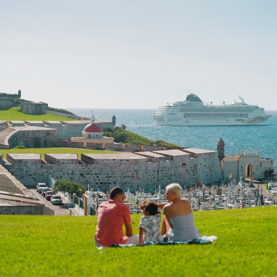 Family looking at cruise ship. 