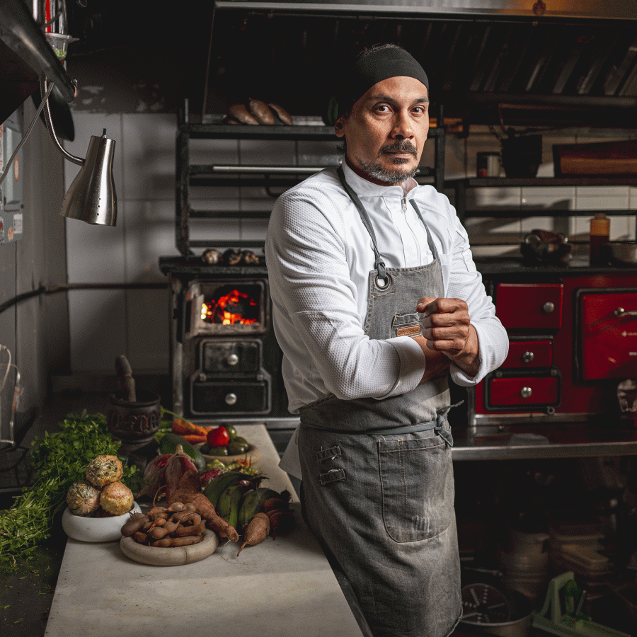 Chef Carlos Portela poses in his kitchen