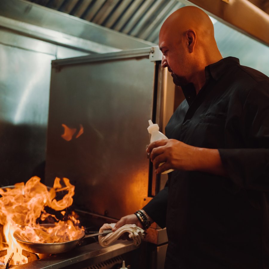 Chef Mario Pagan cooking in the kitchen.