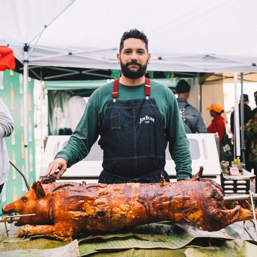 Chef Manolo López roasting a lechón.