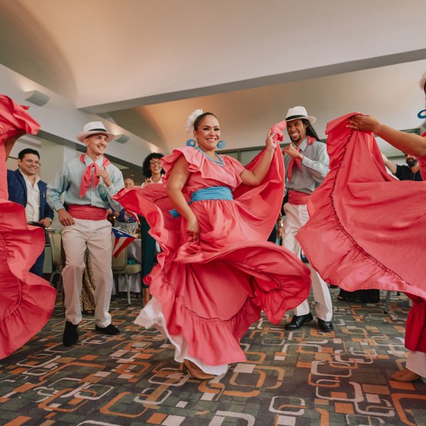 A group dancing plena, a traditional genre of music and dance of Puerto Rico.