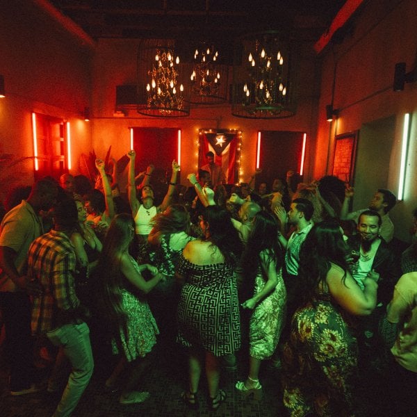 A group of people dancing at a bar in San Juan, Puerto Rico