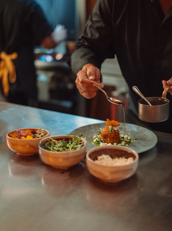 Chef plating dishes.