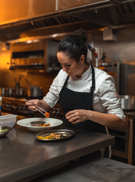 Chef Carol Reyes cooking.