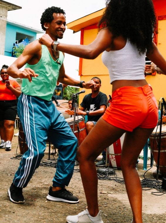 Two people dancing bomba, an improved form of song and dance from Puerto Rico.